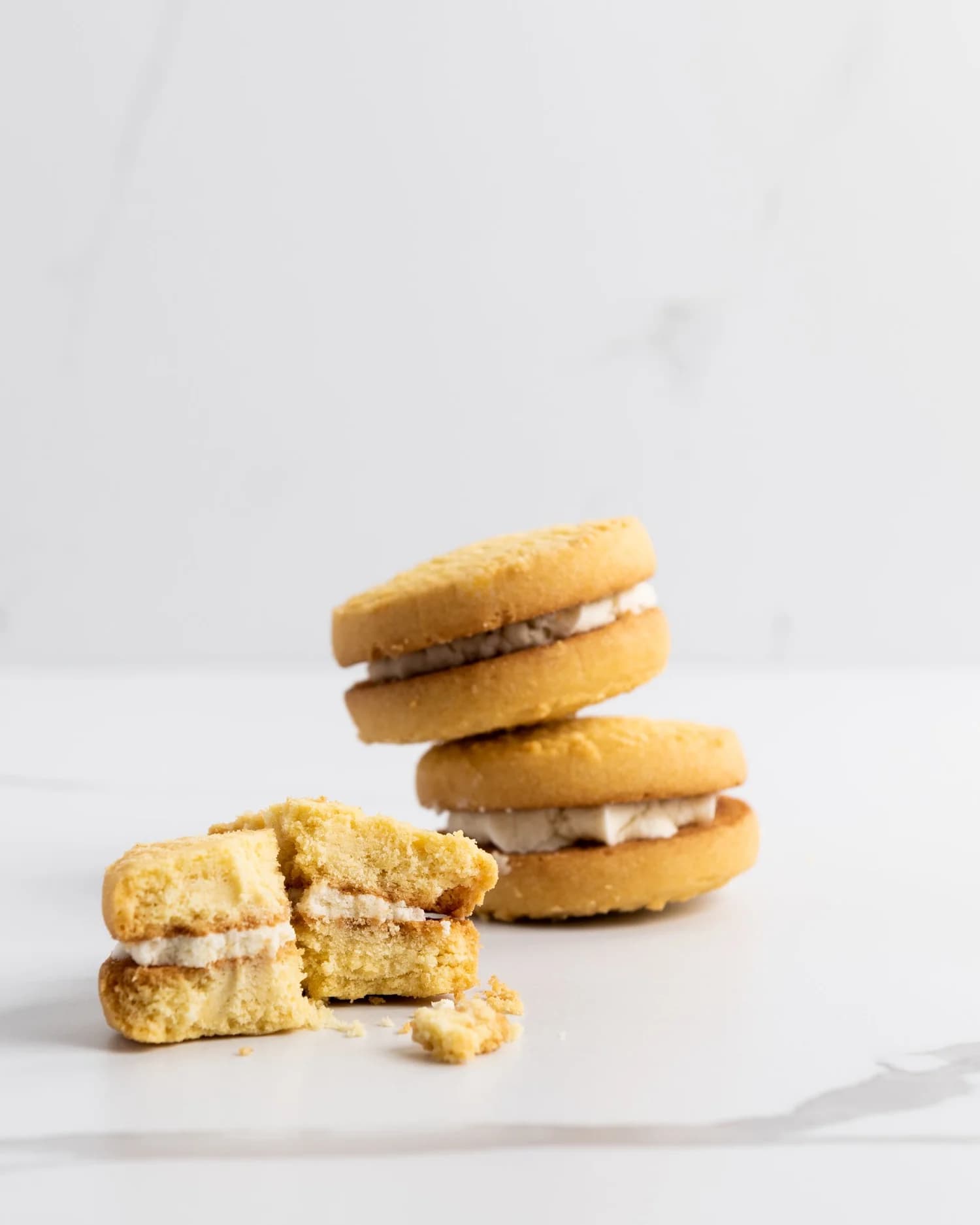 A stack of vanilla melting moments, one broken open